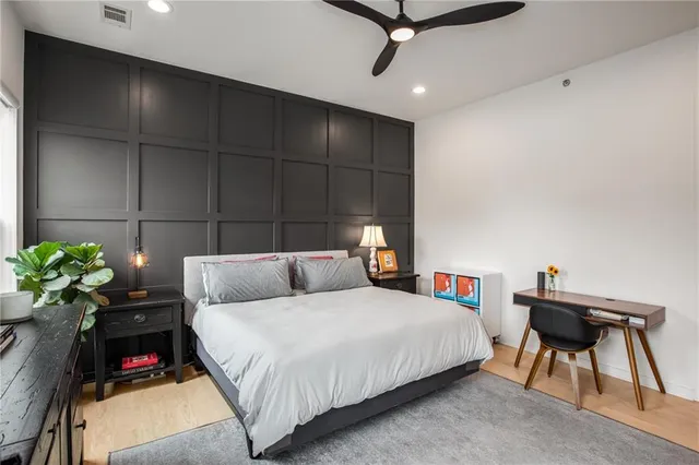 a bedroom with a bed and furniture