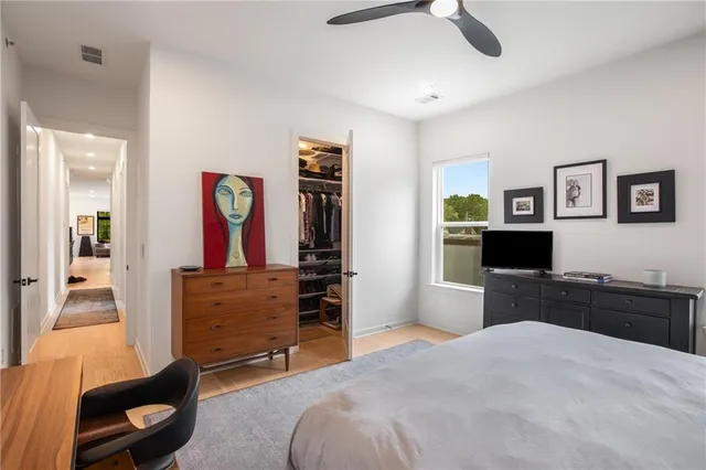 a bedroom with a bed and a dresser