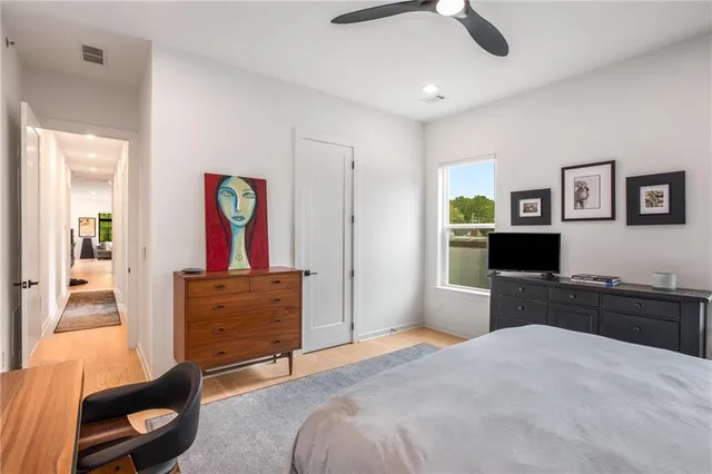 a bedroom with a bed and a television