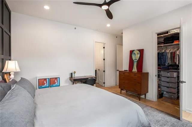 a bedroom with a bed and a tv in it