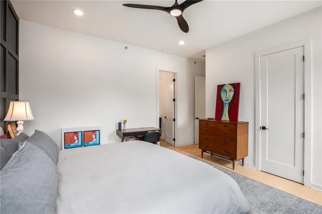 a bathroom with a double vanity sink double mirror bathtub shower and a toilet