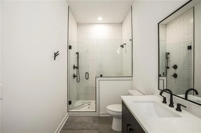 a bedroom with a bed and a potted plant