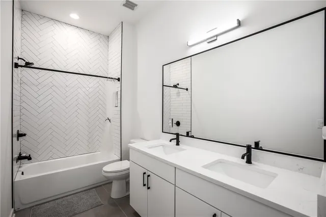 a living room with furniture and a book shelf