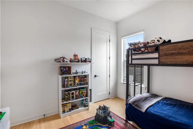 a view of a livingroom with furniture and a gym