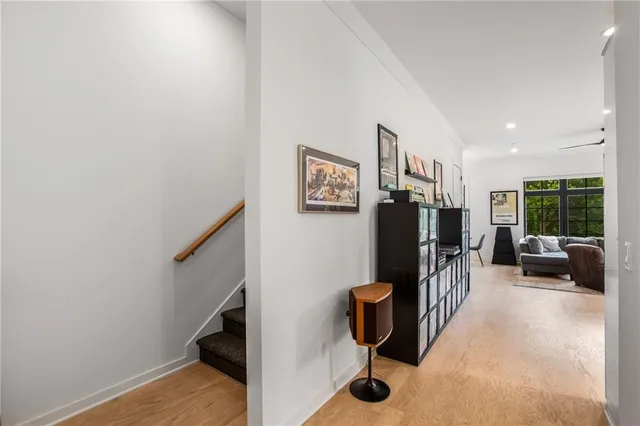 a view of deck with table and chairs under an umbrella with wooden floor