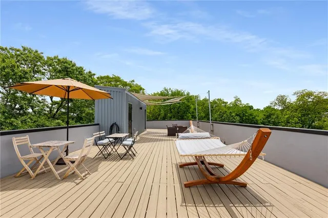 a view of backyard with sitting area