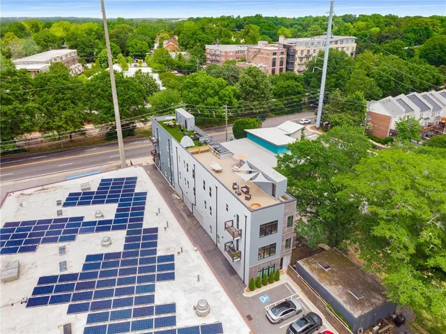 a view of a backyard with sitting area