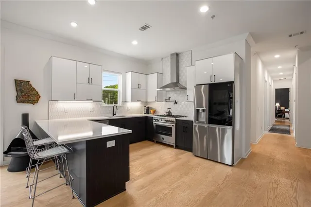 a view of a dining room with furniture and a window