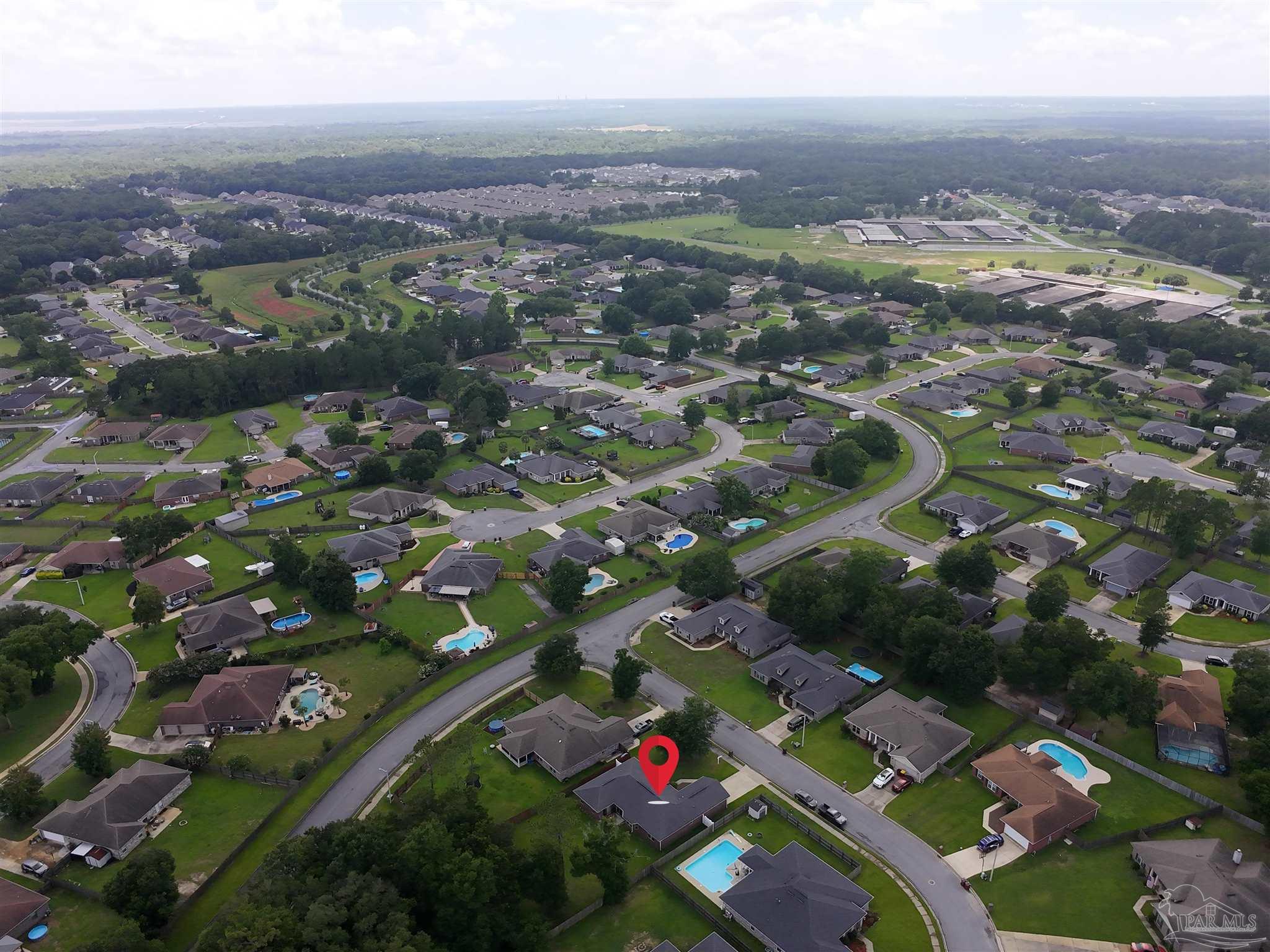 5709 Mill Stream Way Pace, FL 32571 - Photo 7 of 48 an aerial view of city and lake