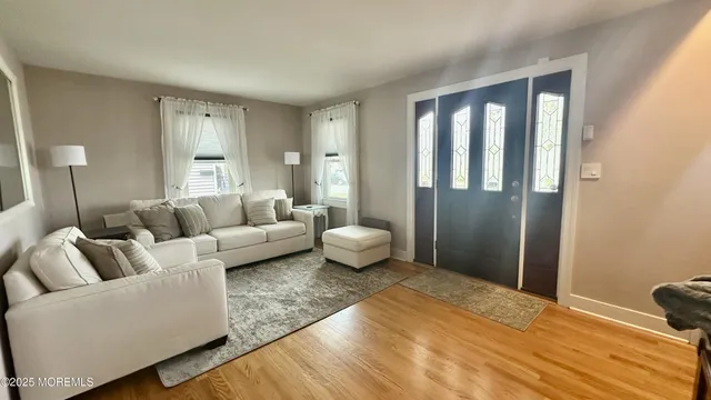 a bedroom with furniture and a rug