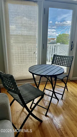 a view of a balcony with wooden floor and wooden floor