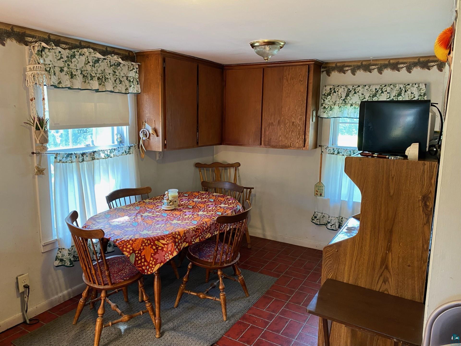 W6402 Old Bass Lake Road Minong, WI 54859 - Photo 6 of 18 Tiled dining area with a wealth of natural light