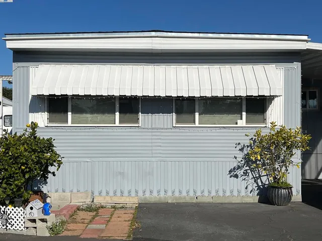 a side view of a house with a garage