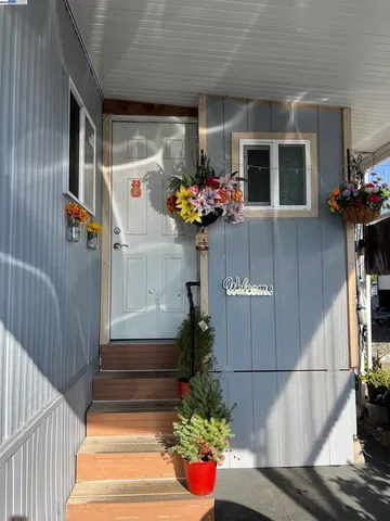 a front view of a house with flowers