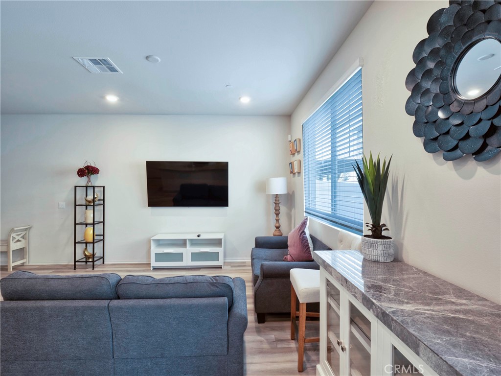 40336 Birchfield Drive Temecula, CA 92591 - Photo 11 of 39 a living room with furniture and a flat screen tv