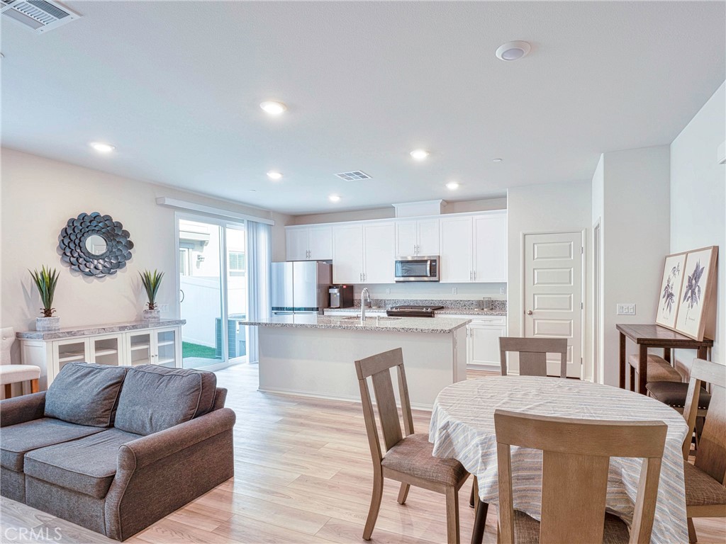 40336 Birchfield Drive Temecula, CA 92591 - Photo 12 of 39 a living room with stainless steel appliances kitchen island granite countertop furniture and a large window