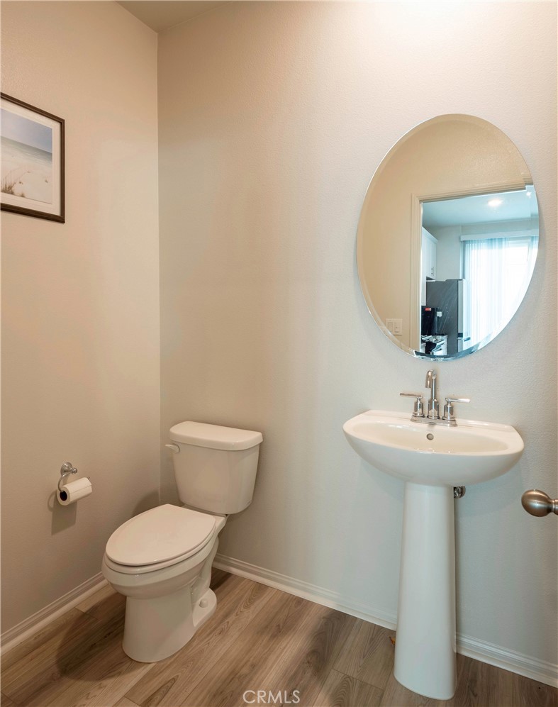 40336 Birchfield Drive Temecula, CA 92591 - Photo 17 of 39 a bathroom with a toilet sink and mirror