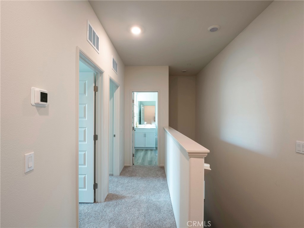40336 Birchfield Drive Temecula, CA 92591 - Photo 20 of 39 a view of hallway with bathroom and a window