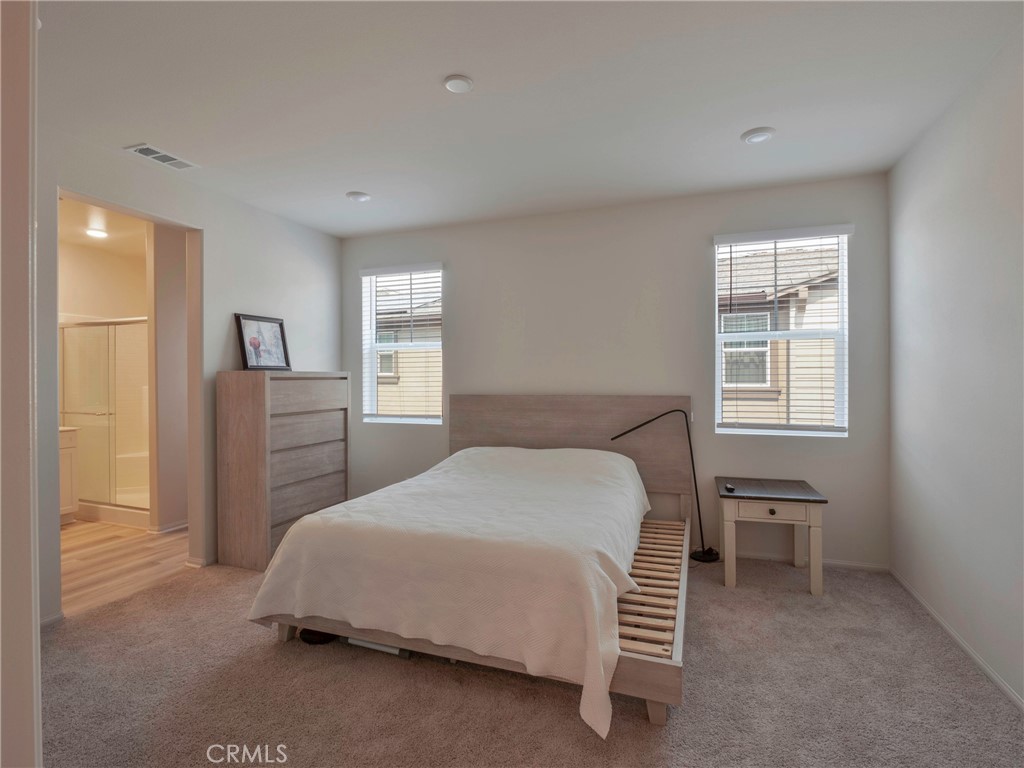 40336 Birchfield Drive Temecula, CA 92591 - Photo 21 of 39 a bedroom with a bed and a window