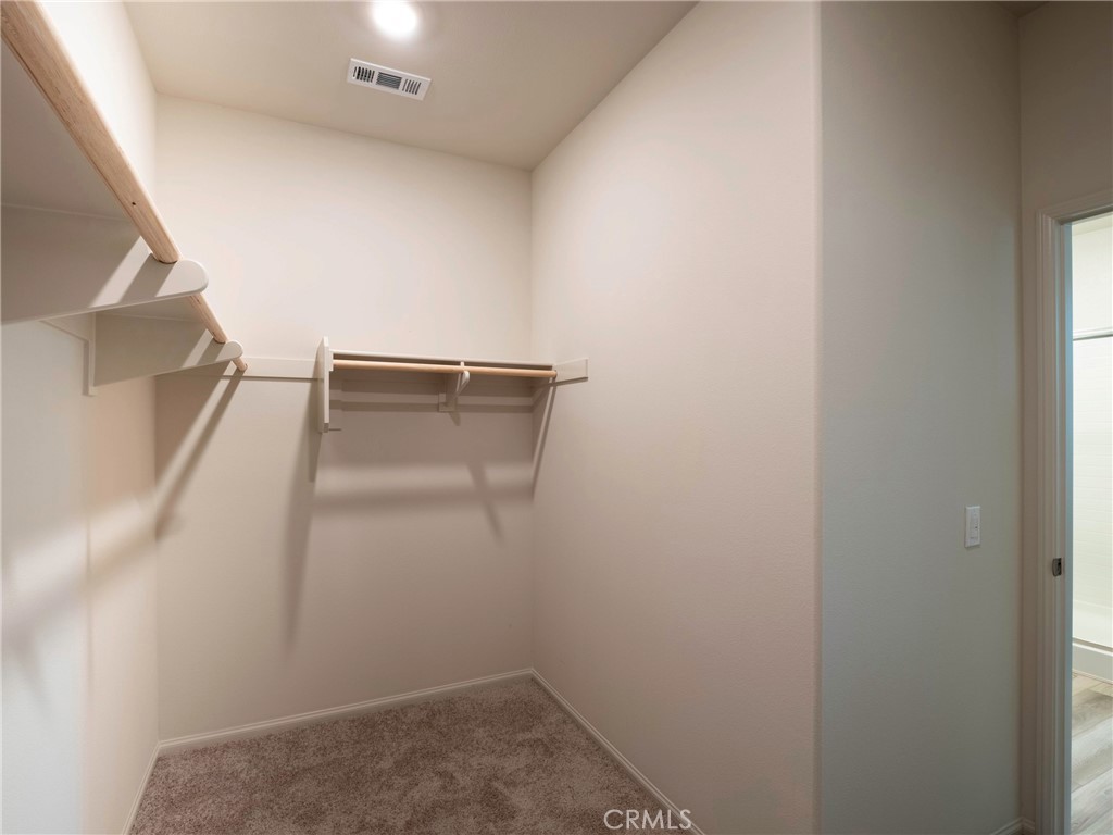 40336 Birchfield Drive Temecula, CA 92591 - Photo 23 of 39 a view of storage and utility room with racks on the wall