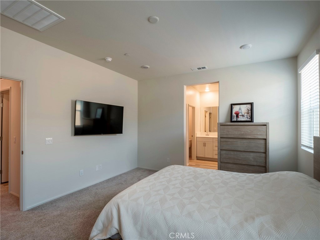 40336 Birchfield Drive Temecula, CA 92591 - Photo 24 of 39 a bedroom with a bed and flat screen tv