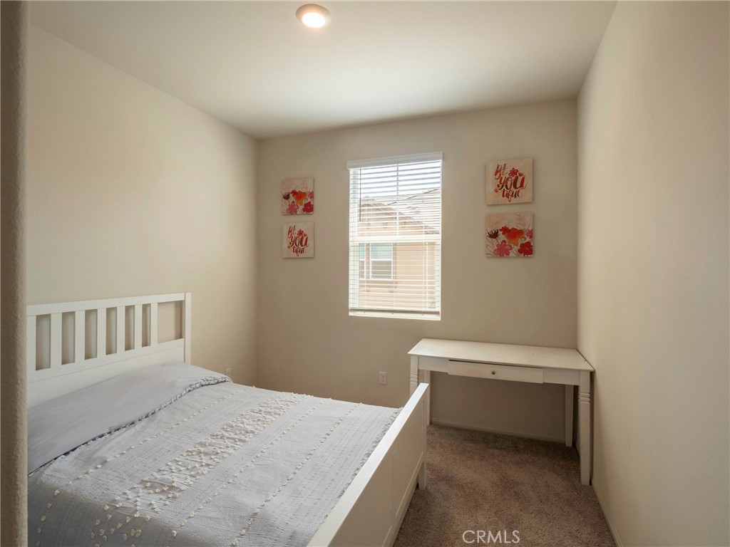 40336 Birchfield Drive Temecula, CA 92591 - Photo 25 of 39 a bedroom with a bed and a window