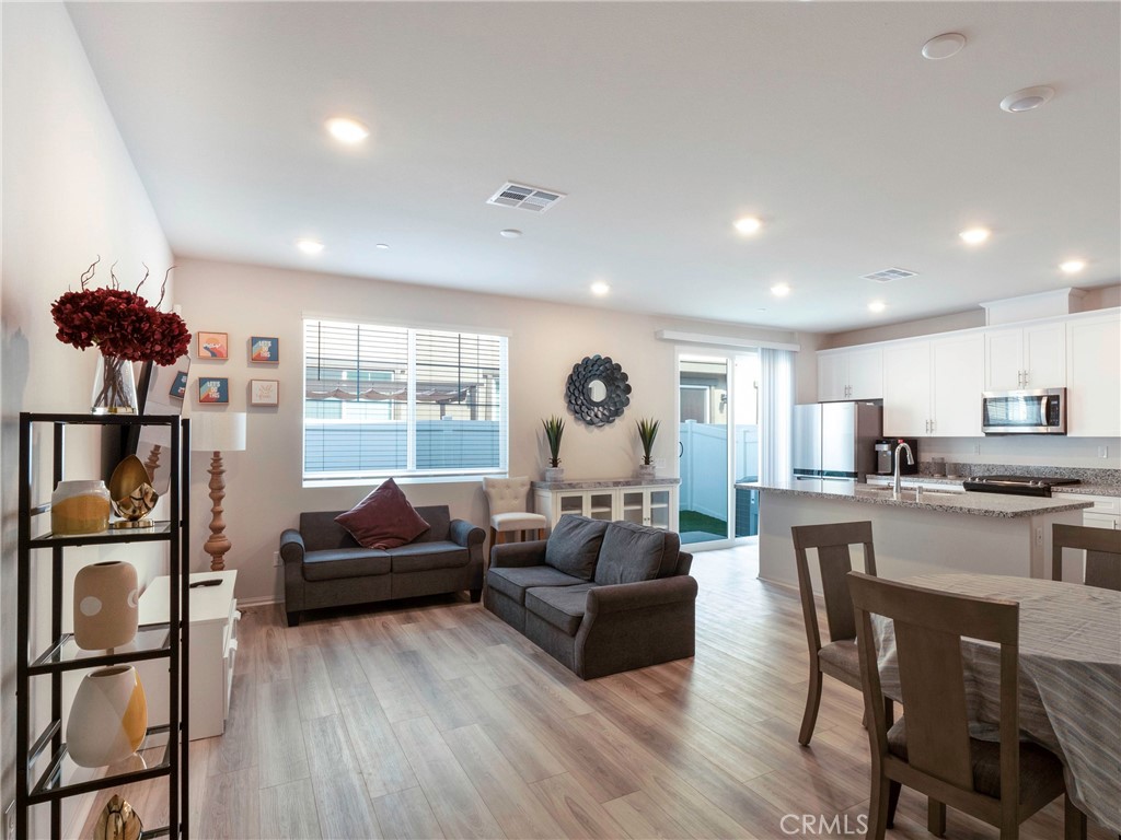 40336 Birchfield Drive Temecula, CA 92591 - Photo 8 of 39 a living room with furniture and a wooden floor