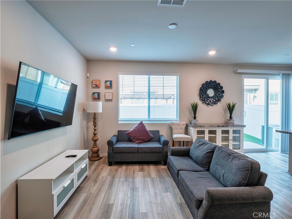 40336 Birchfield Drive Temecula, CA 92591 - Photo 9 of 39 a living room with furniture and a flat screen tv