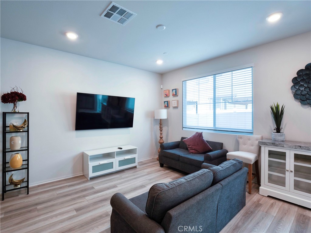 40336 Birchfield Drive Temecula, CA 92591 - Photo 10 of 39 a living room with furniture and a flat screen tv