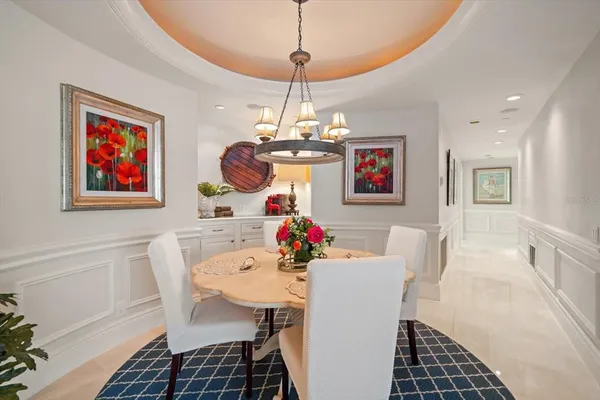 a kitchen with a table and chairs in it