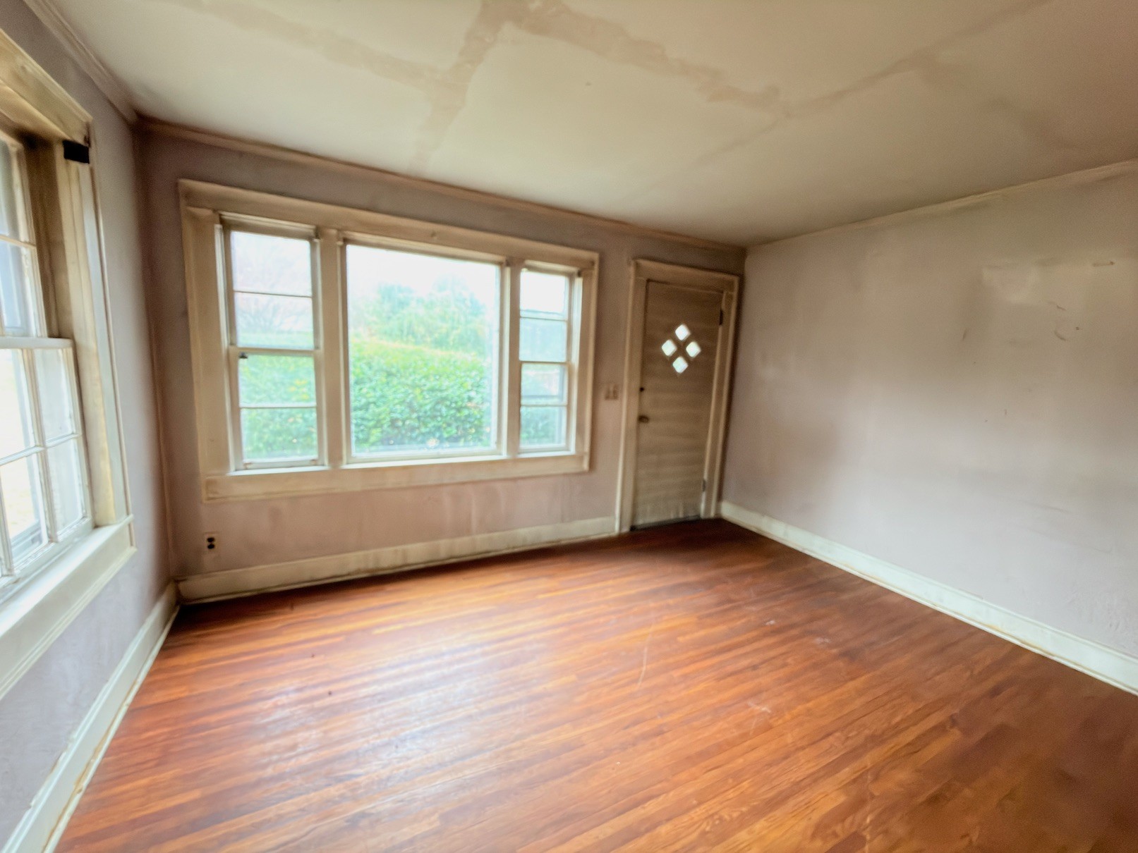 2594 Faulkner Springs Road McMinnville, TN 37110 - Photo 12 of 17 a view of an empty room with wooden floor and a window