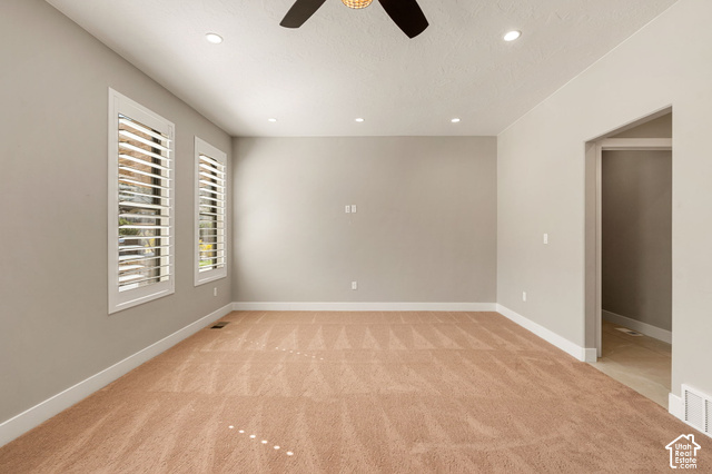 1192 East Ashdown Road Cedar City, UT 84721 - Photo 57 of 96 Recessed ceiling lighting, a ceiling fan, dual windows with plantation shutters, neutral-toned walls, and plush carpeting