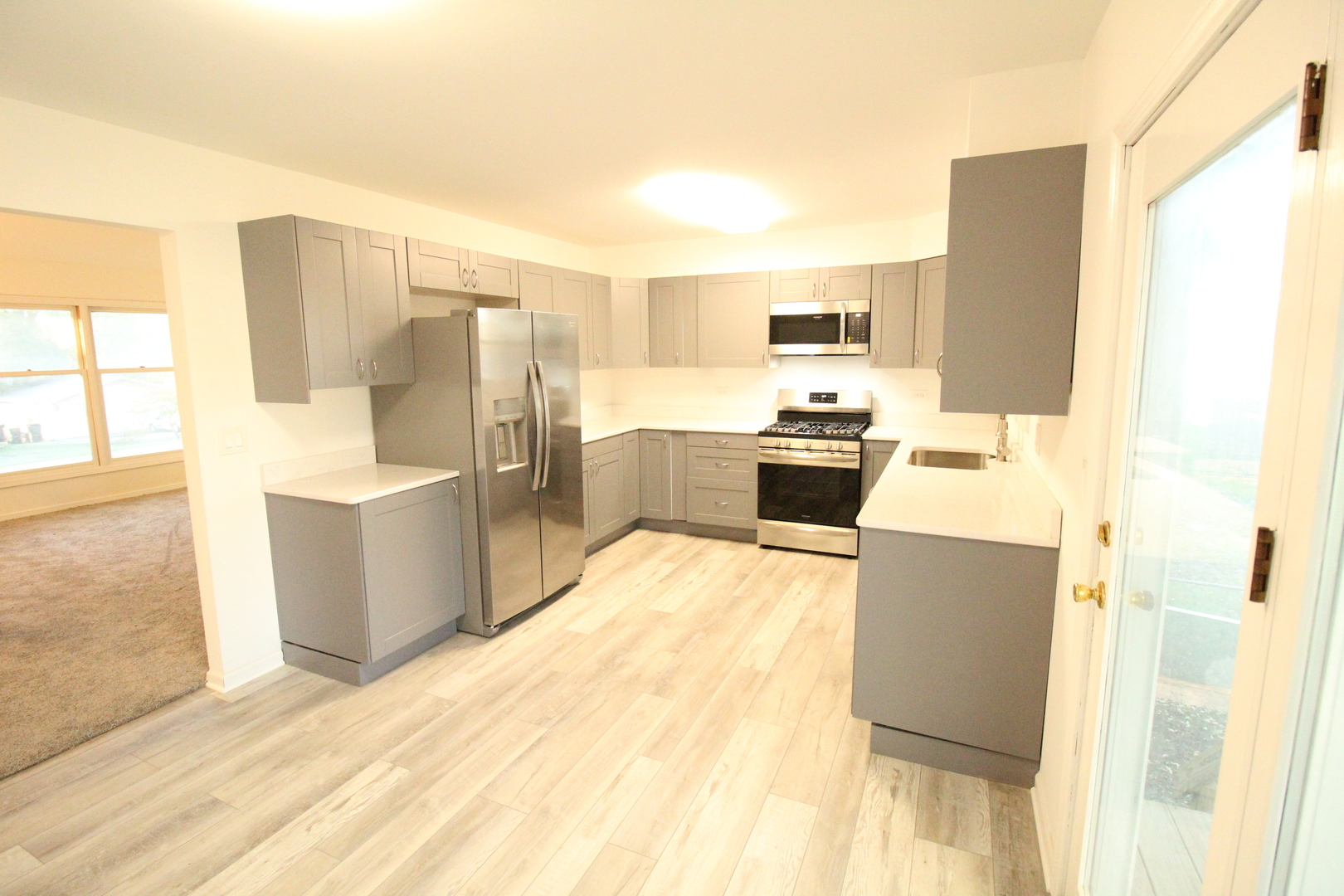 3 Deerpath Road Lake In The Hills, IL 60156 - Photo 3 of 22 a kitchen with stainless steel appliances a stove a refrigerator a sink and dishwasher