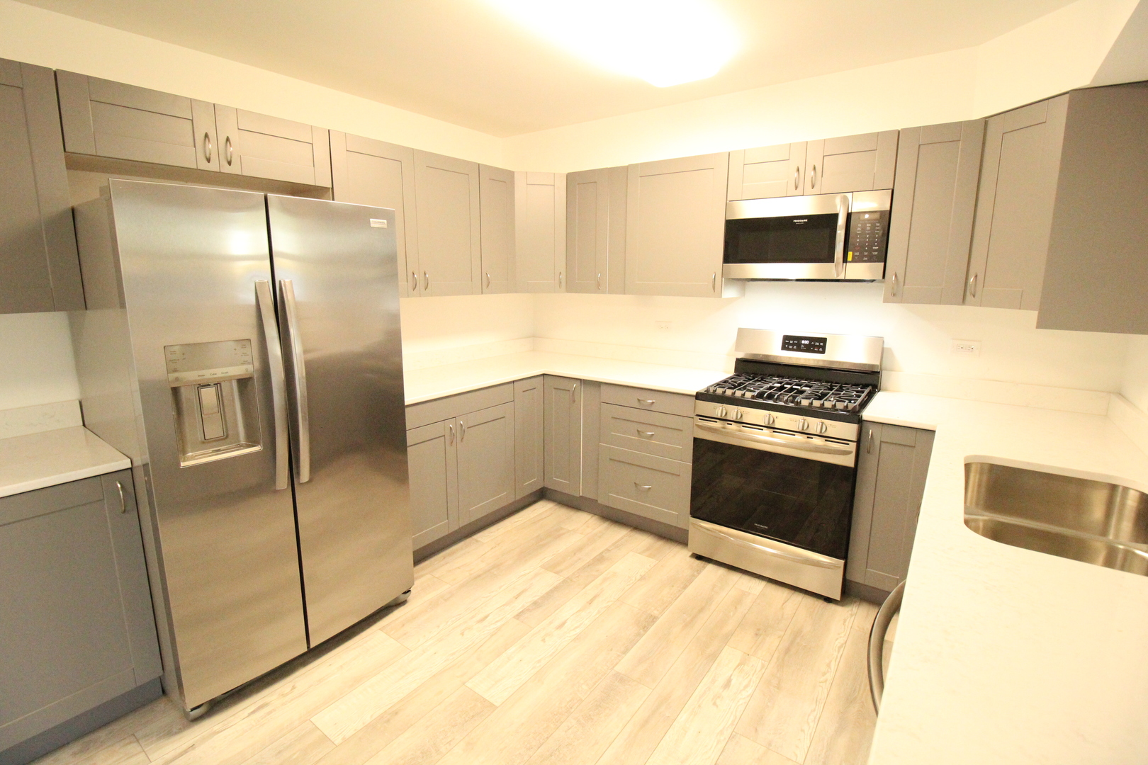 3 Deerpath Road Lake In The Hills, IL 60156 - Photo 5 of 22 a kitchen with stainless steel appliances a refrigerator a stove a sink and a microwave