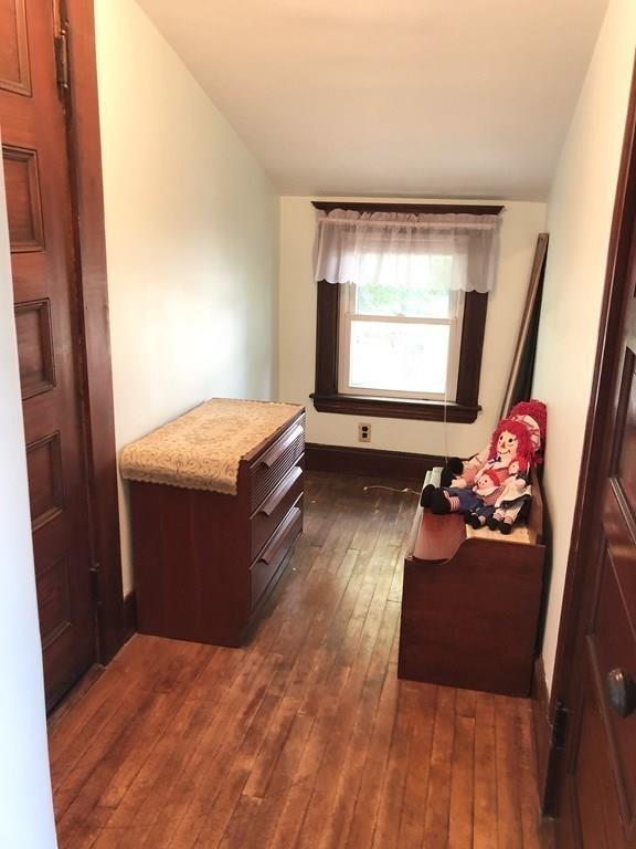 16 Bluff Road Weymouth, MA 02191 - Photo 13 of 20 a room with a bed and a dresser