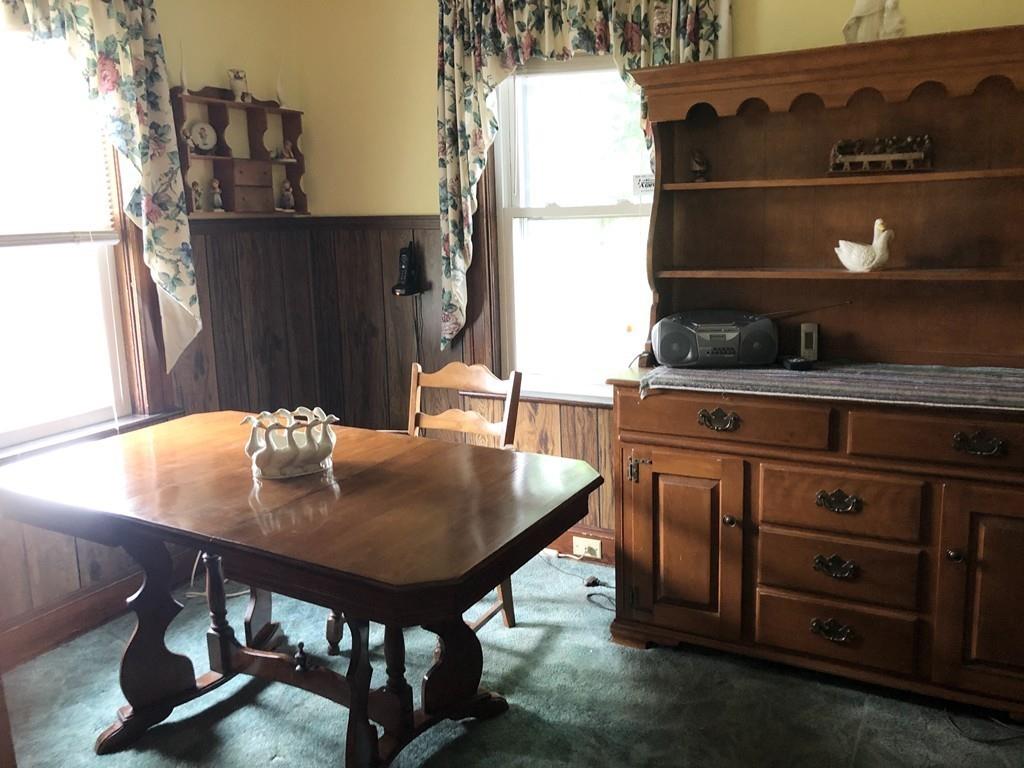 16 Bluff Road Weymouth, MA 02191 - Photo 3 of 20 a table and chairs in a kitchen