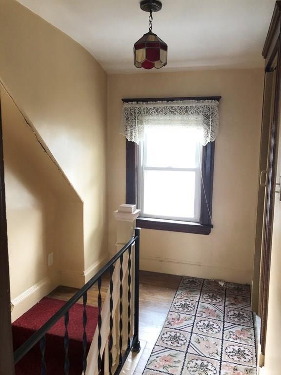 16 Bluff Road Weymouth, MA 02191 - Photo 8 of 20 a view of entryway with a window and a rug