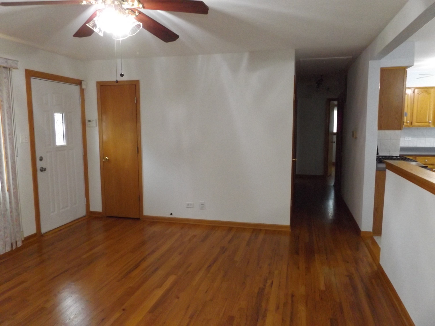 6953 Olympic Drive Bridgeview, IL 60455 - Photo 20 of 33 wooden floor in an empty room with a window