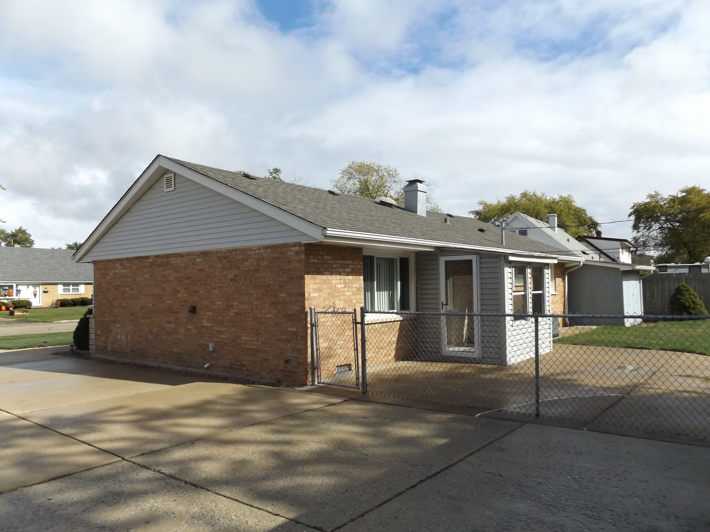 6953 Olympic Drive Bridgeview, IL 60455 - Photo 5 of 33 a front view of a house with a yard and garage