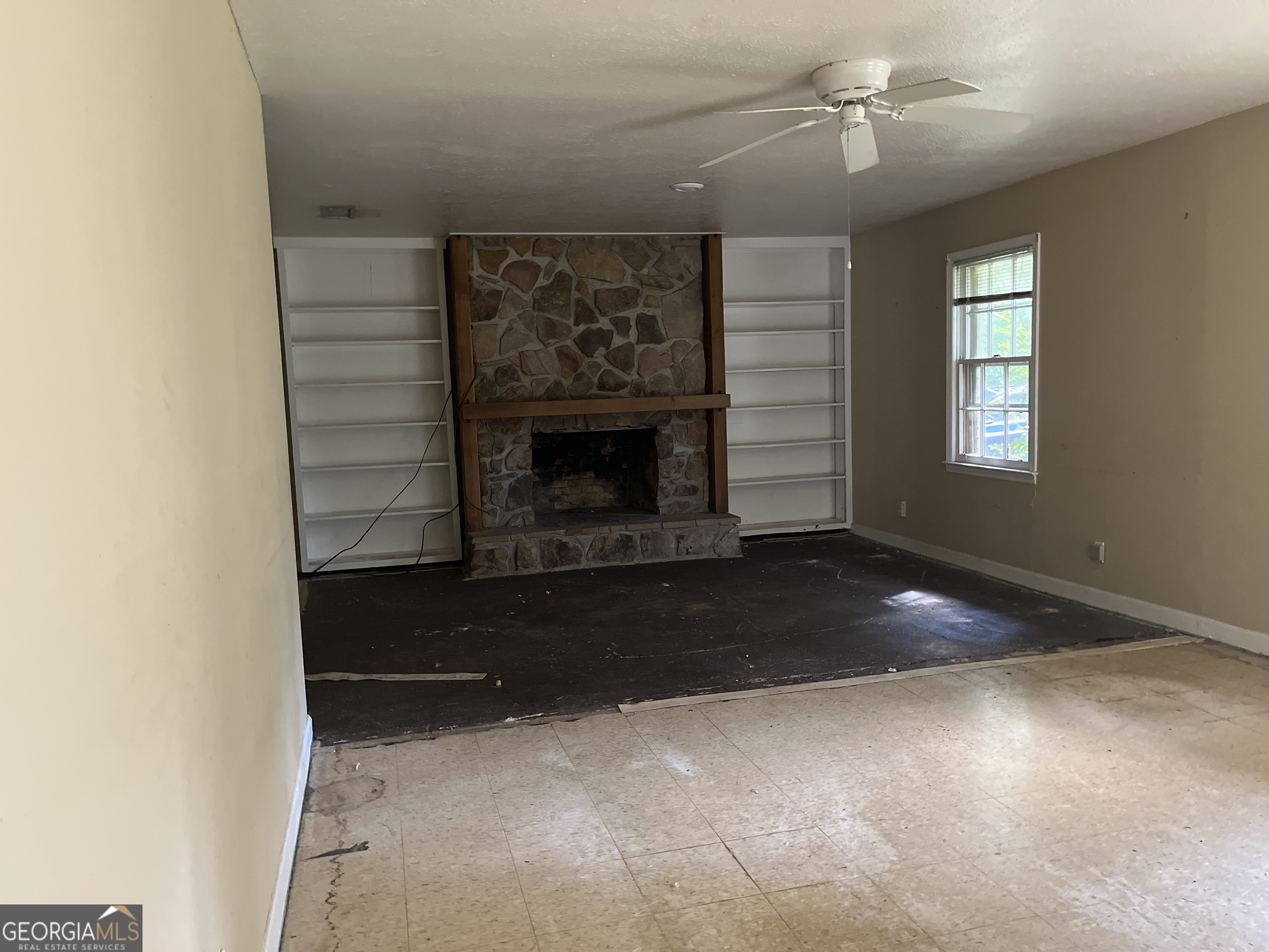 3912 Coakley Avenue Albany, GA 31721 - Photo 2 of 14 a living room with furniture and a fireplace