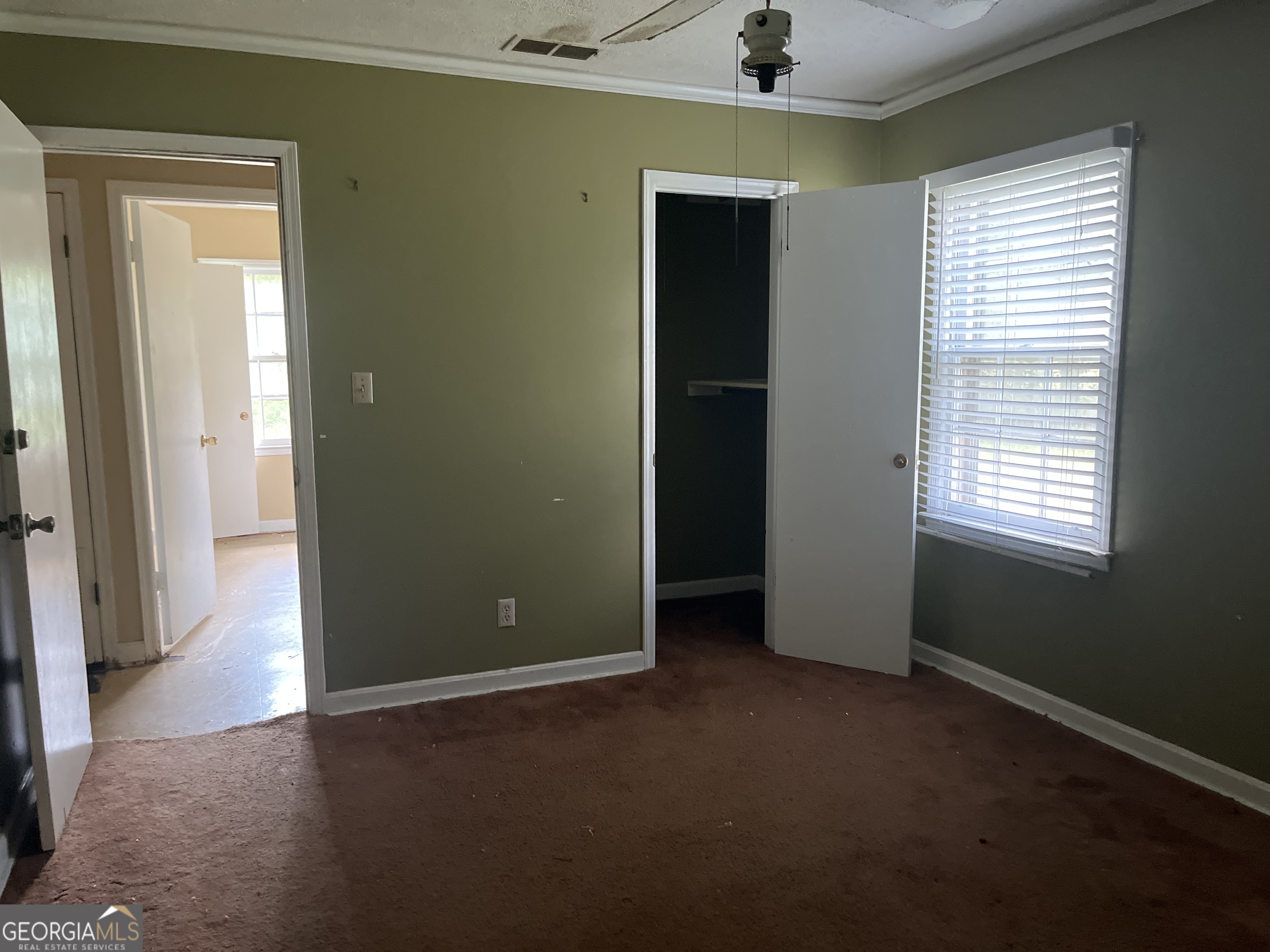 3912 Coakley Avenue Albany, GA 31721 - Photo 7 of 14 an empty room that has a window and wooden floor