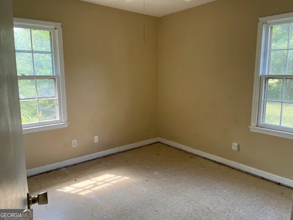 an empty room with windows
