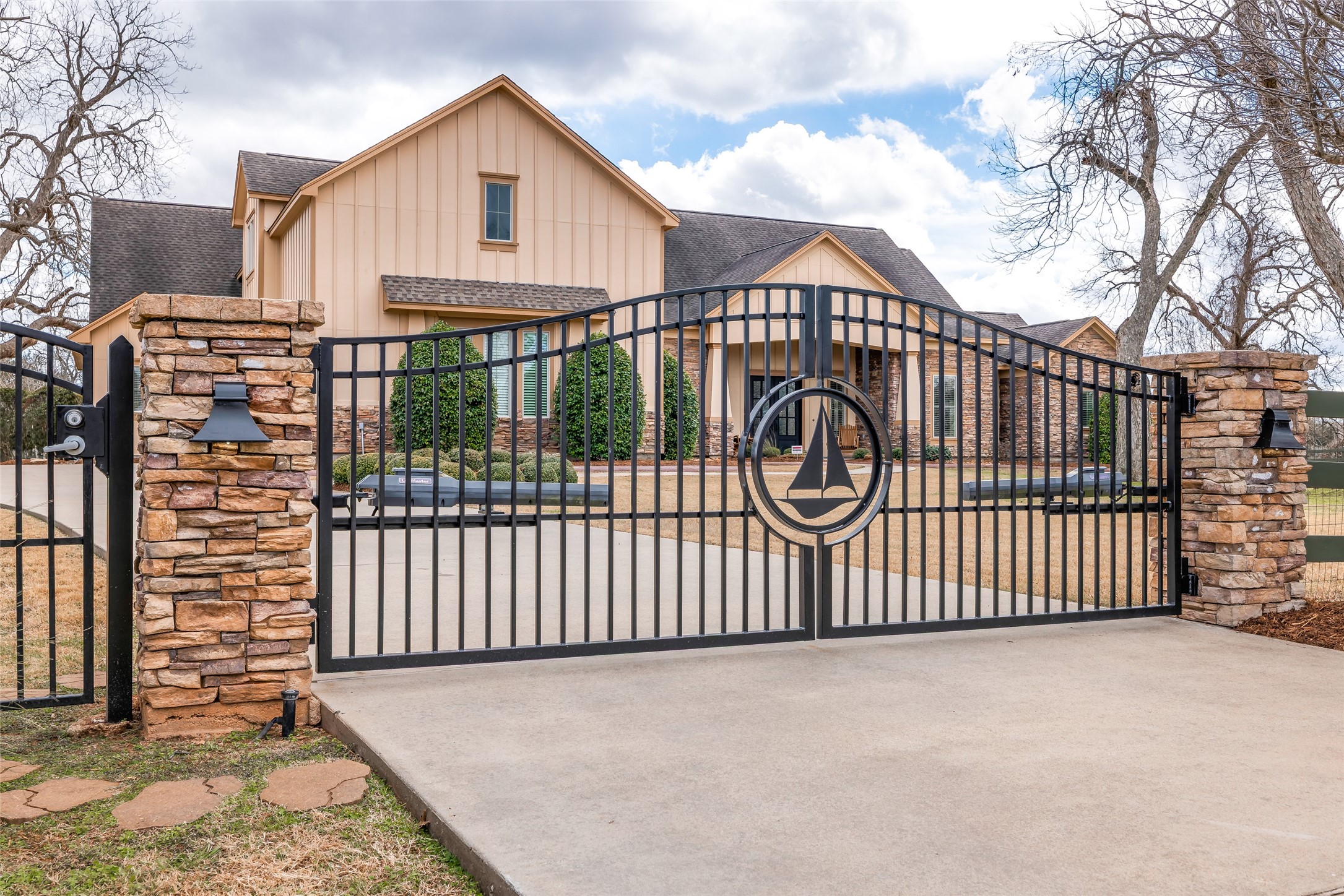 31102 Lower Oxbow Trace Fulshear, TX 77441 - Photo 44 of 50 Electric gates for extra security, also side pedestrian gate