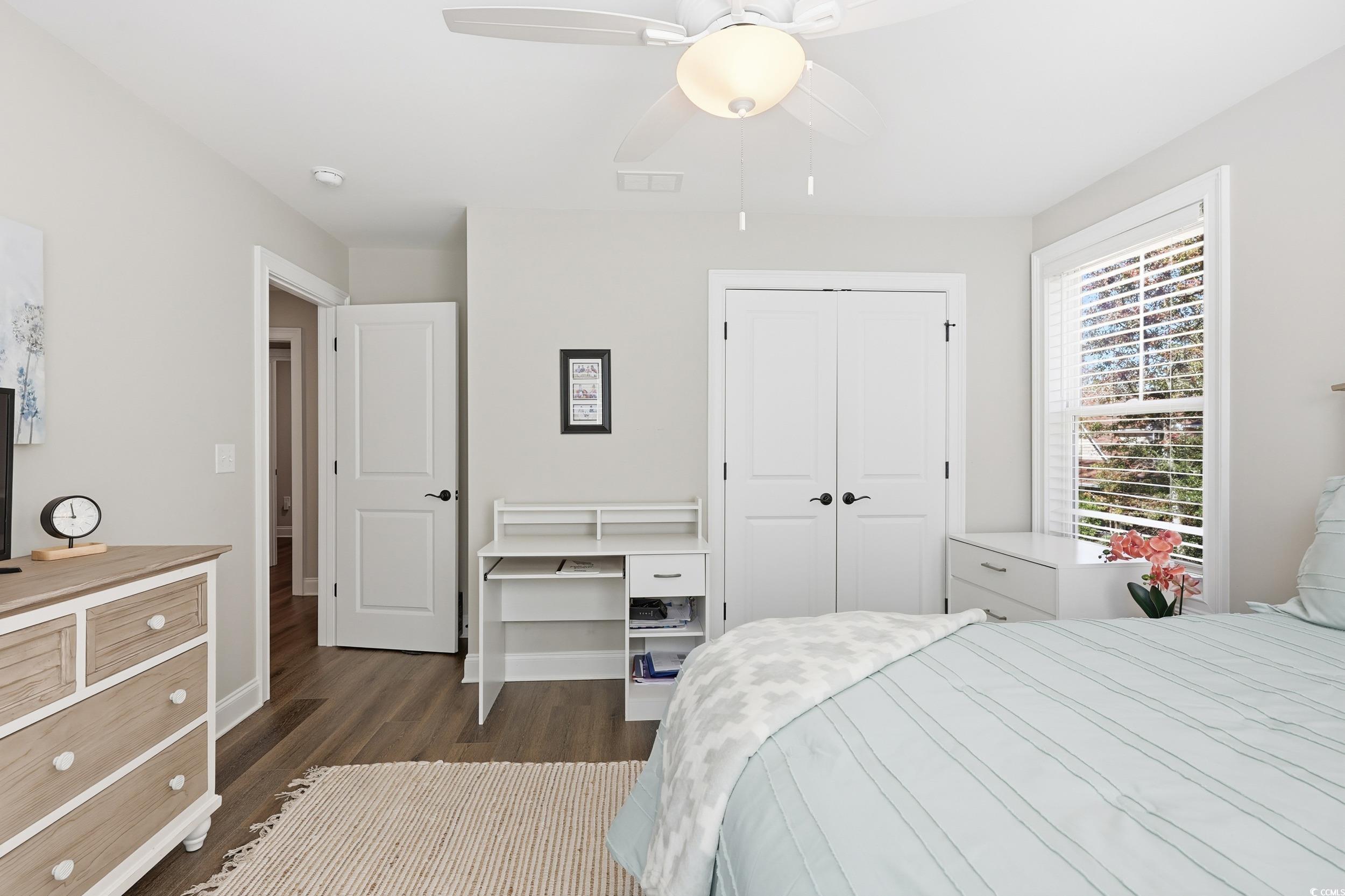 485 Kings River Road Pawleys Island, SC 29585 - Photo 28 of 39 Bedroom with dark wood finished floors, a ceiling fan, and a closet