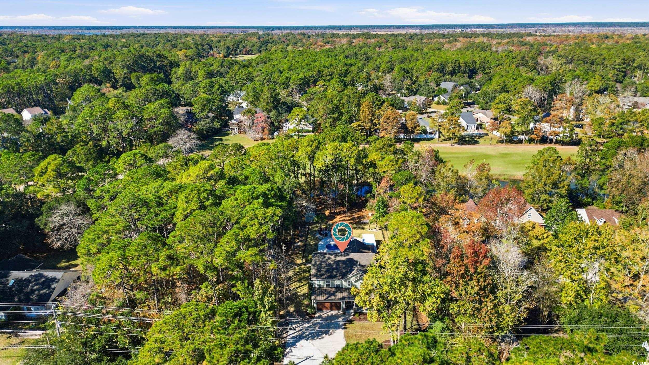 485 Kings River Road Pawleys Island, SC 29585 - Photo 38 of 39 Aerial view of residential area with a heavily wooded area
