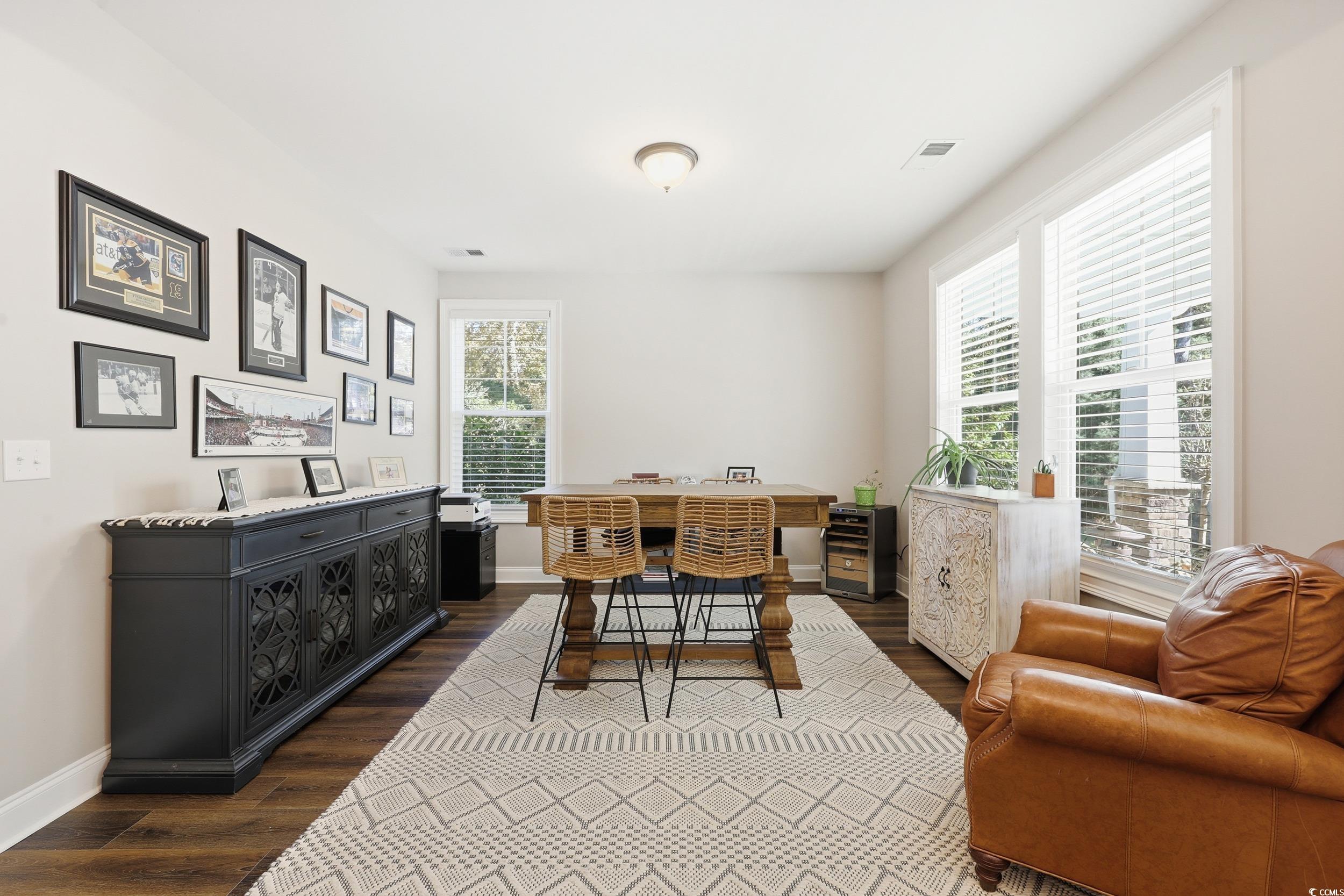 485 Kings River Road Pawleys Island, SC 29585 - Photo 6 of 39 Dining space with dark wood finished floors and a desk