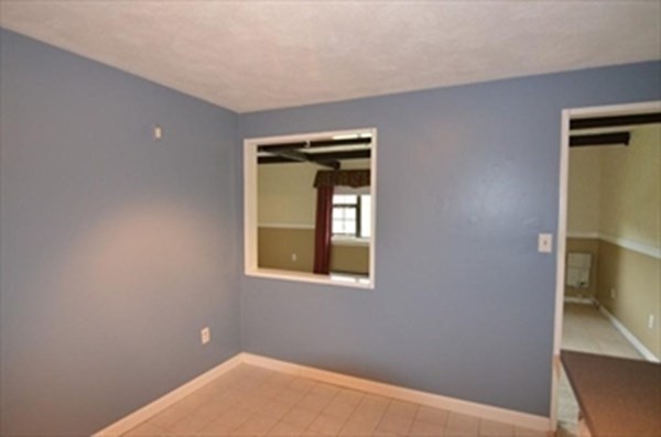 24 Spencer Road, Unit 36N Boxborough, MA 01719 - Photo 3 of 12 a view of an empty room and window