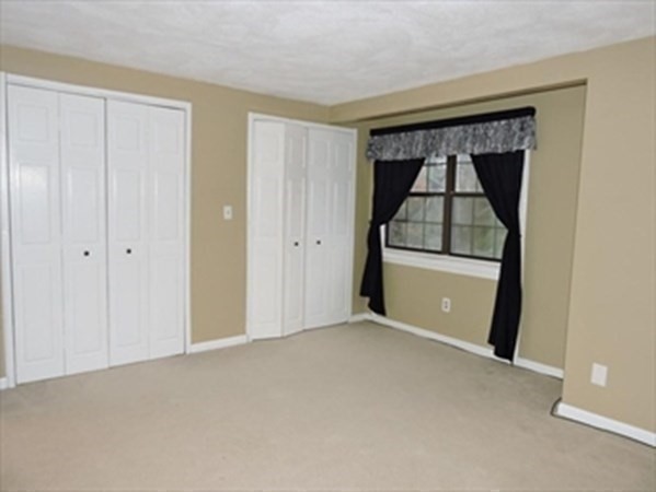 24 Spencer Road, Unit 36N Boxborough, MA 01719 - Photo 7 of 12 a view of empty room with wooden floor