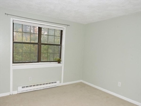 24 Spencer Road, Unit 36N Boxborough, MA 01719 - Photo 8 of 12 an empty room with a window