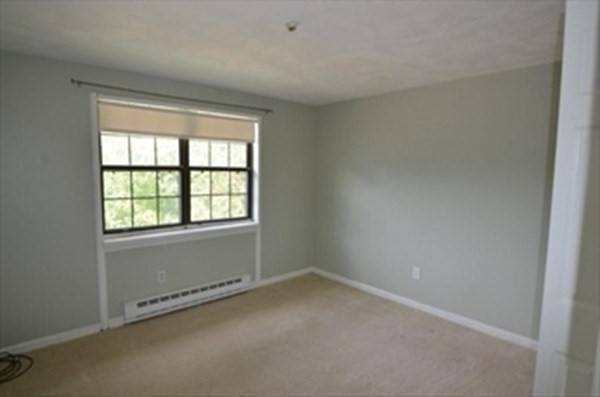 24 Spencer Road, Unit 36N Boxborough, MA 01719 - Photo 9 of 12 an empty room with a window